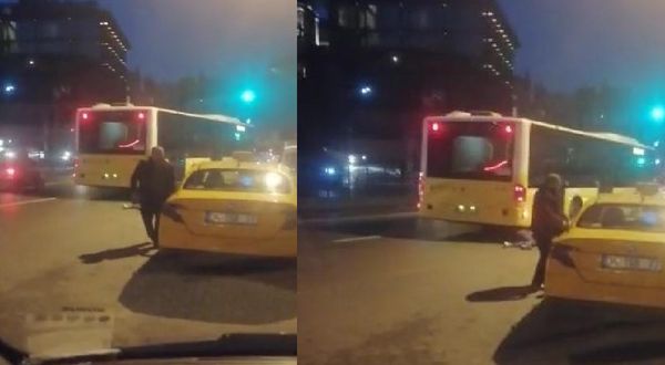 Taksicinin ittiği kadın, otobüsün altında kalmaktan son anda kurtuldu